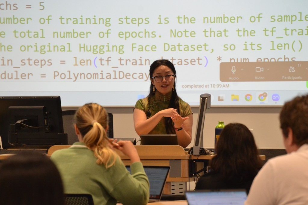 Summer Program instructor teaching in front of a slide
