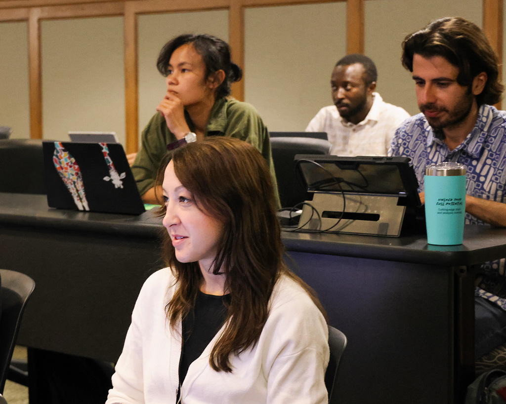 Summer Program participants sitting at tables